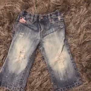 Distressed baby Levi jeans